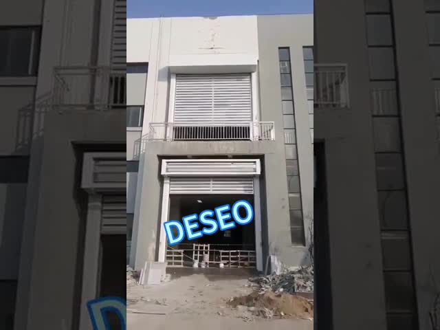 Порошок покрыл промышленную высокоскоростную спиральную дверь свертывает вверх весны расширения предкрылков двери 220mm алюминиевые видео