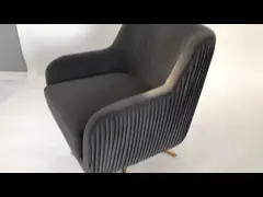 Swivel chair with golden stainless steel base and grey velvet