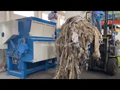 A plastic shredder for mulch film recycling process