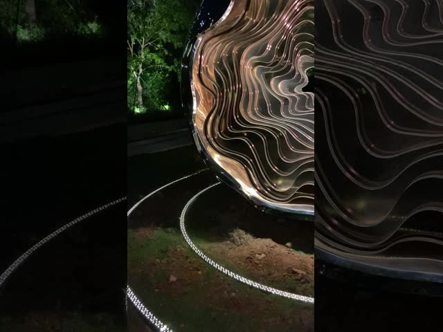 Outdoor garden at night large abstract sculpture LED lights with light wave changes welcome custom sculpture