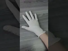 Стерильные устранимые перчатки латекса пудрят перчаток перчаток латекса порошка гражданское свободных бывших устранимое используя перчатки video