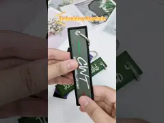 Граница Overlock вышила бирке Keychains двигателя ключевых цепей выдвиженческой video