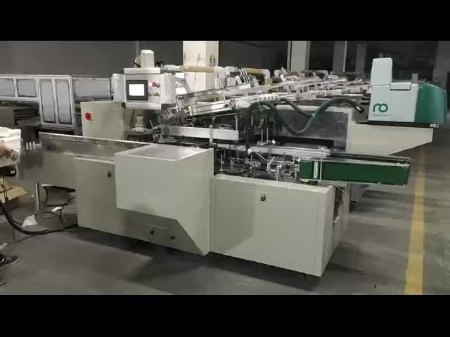 全自動V折り顔面用ペーパー 箱付き梱包機