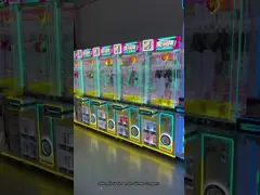 China Dreamland Hot Sale Transparent Doll Park Arcade Claw Crane Machine For sale UK supplier