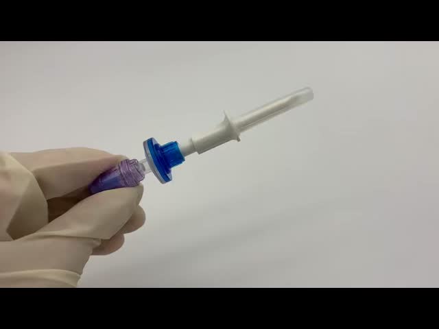 Needleless IV Bag Spike with Filter and Lipid/Alcohol Resistant Valve Port