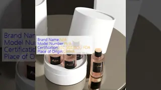 A custom-designed luxury textured leather cylindrical box, an eco-friendly 6ml fragrance packaging set including a paper tube.
